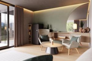拉貢多的住宿－Avidea - Adults Only，客厅配有桌子和两把椅子