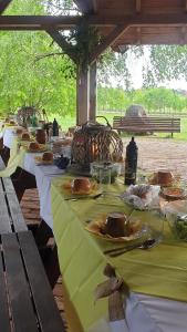 a row of tables with plates of food on them at Żabie Oko in Kruklanki