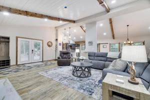 a living room with a couch and a table at Whiskey Pines Retreat! Single Level Home, Outdoor Firepit, AC, BBQ! Sleeps 9 in Lake Harmony! in Lake Harmony