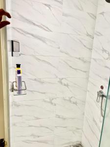 a bathroom with a white marble shower stall at Summer suites near klcc in Kuala Lumpur