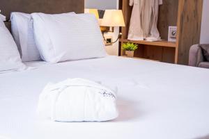 Postel nebo postele na pokoji v ubytování Amfora Hotel & Spa