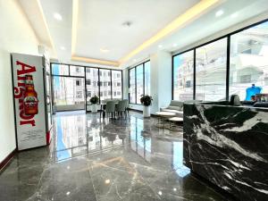 an office with a lobby with tables and chairs at SKYVIEW Residence & Apartments Sihanoukville in Sihanoukville