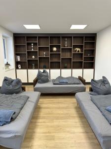 a room with three beds in a room with shelves at wobStay family & fitters in Worbis