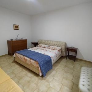 Giường trong phòng chung tại Appartamento Fotia