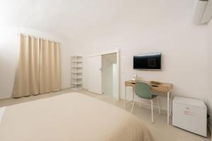 TV a/nebo společenská místnost v ubytování Napoli Maison
