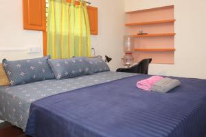 Säng eller sängar i ett rum på Da Mantra House