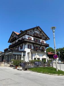 a large building on the side of a street at 2 Zimmer Ferienwohnung „Schliersberg“ in Schliersee