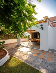 a patio of a house with a table and chairs at Villas Las Almenas in Maspalomas