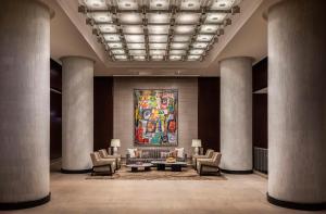 a lobby with a large painting on the wall at Park Hyatt Chicago in Chicago