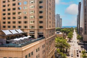 a building with a rooftop restaurant on the side of it at Park Hyatt Chicago in Chicago