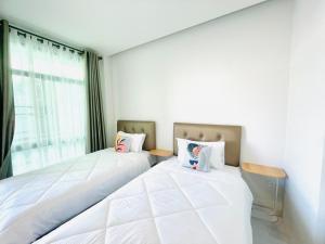Sky View Home and Hostel Chiangmai客房内的一张或多张床位