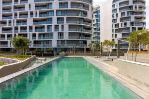 an empty swimming pool in front of a building at #AlimamaSpaces: Jay's Cassini in Midrand