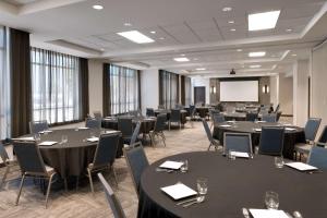 a conference room with tables and chairs and a screen at Hyatt Place Provo in Provo +39 photos