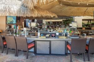 a bar in a restaurant with chairs and a counter at Hilton Vacation Club Ka'anapali Beach Maui in Lahaina