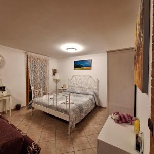 a bedroom with a bed and a table in a room at Appartamento Grifagni in Florence