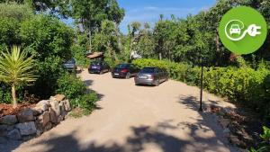 a group of cars parked on a dirt road at Les Hauts de la Riviera in Cabris