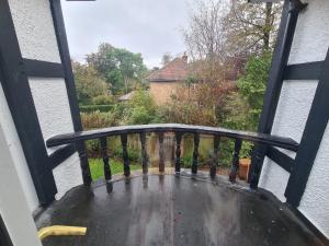 a balcony with a view of a yard at 23 HeadsLane in Hessle