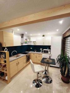 a kitchen with a table and chairs in it at Baky House in Balatonlelle