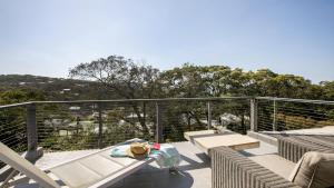A balcony or terrace at Bush and Bay Setting With Easy Walk To Beach