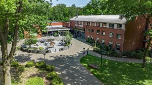 an overhead view of a building with a courtyard at 50|50 Hotel Belmont in Ede