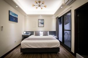 South of Penghu Homestay 객실 침대
