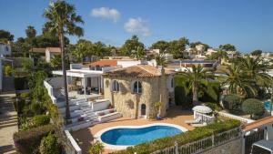 an aerial view of a house with a swimming pool at Casa Peponi - By Almarina Villas in Jávea