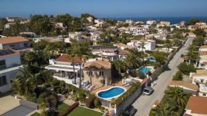 an aerial view of a coastal town with houses at Casa Peponi - By Almarina Villas in Jávea