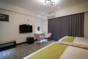 South of Penghu Homestay 객실 침대