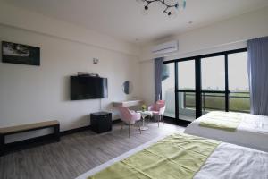 South of Penghu Homestay 객실 침대