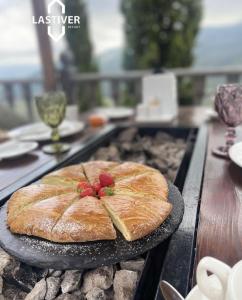 a cake sitting on a plate on a grill at Lastiver Resort in Yenokavan