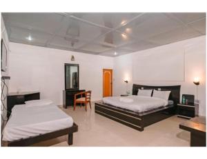 Tempat tidur dalam kamar di Shiv Sutra Resorts, Mussoorie