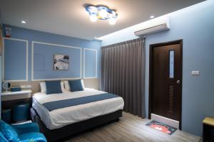 South of Penghu Homestay 객실 침대