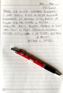 a red pen sitting on top of a sheet of paper at L’elegante dépendance del Barone Francesco Sala in Agrigento