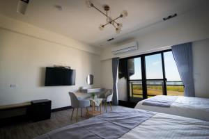 South of Penghu Homestay 객실 침대