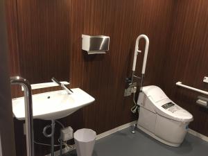 a bathroom with a toilet and a sink at KIZUNA HOTEL Gojo Kiyomizu-dera Kamogawa in Kyoto