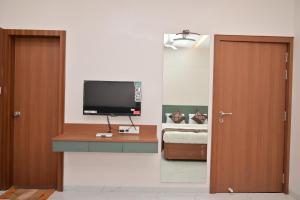 TV o dispositivi per l'intrattenimento presso Hotel D Square
