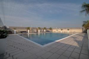 a swimming pool on the roof of a building at Svelte Hotel and Personal Suites in New Delhi