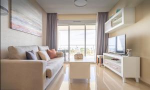 TV a/nebo společenská místnost v ubytování CASA AMANECER 1ªLinea de Playa Familiar