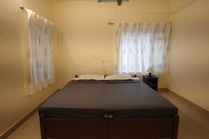 Ein Bett oder Betten in einem Zimmer der Unterkunft Cliff & Coral