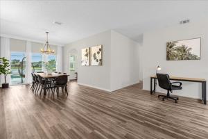 a dining room with a table and chairs in a house at 4 Bathrooms 3 Bathrooms Cresent Lakes 5305 Cv in Kissimmee