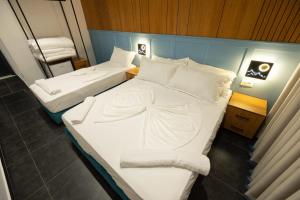 Postelja oz. postelje v sobi nastanitve Aglon Twin's Hotel