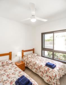 Postel nebo postele na pokoji v ubytování Villas Las Almenas + 37 fotografií