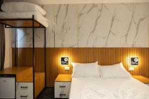 Postelja oz. postelje v sobi nastanitve Aglon Twin's Hotel