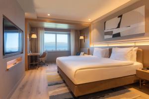 Postel nebo postele na pokoji v ubytování Kolin Hotel Spa & Convention Center