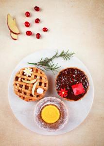 a plate of food with waffles and fruit on it at JW Marriott Hotel Chandigarh in Chandīgarh