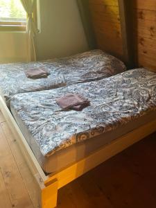 two twin beds in a room at Hiša Pr Valter in Jesenice