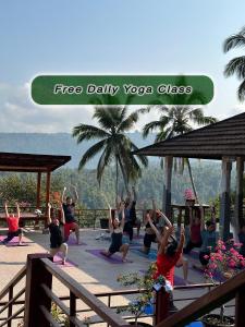 a group of people in a yoga class at VILLA IPSA in Munduk