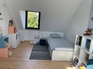 a bedroom with a bed and a teddy bear at Chambres d'Hôtes B&B Roz Rozenn in Sauzon