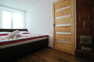 Postel nebo postele na pokoji v ubytování Apartmán 4M Tatry