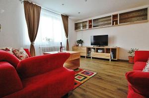 TV a/nebo společenská místnost v ubytování Apartmán 4M Tatry